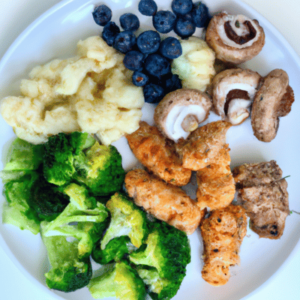 A plate of lectin-free food, including vegetables, fruits, and proteins